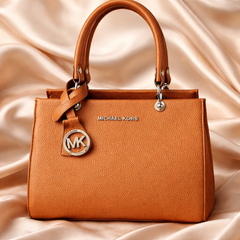 Michael Kors Sutton Medium Leather Satchel handbag in a brown color.