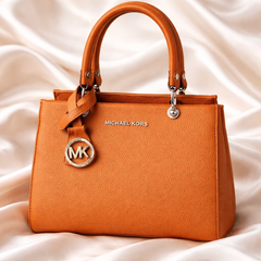 Michael Kors Sutton Medium Leather Satchel handbag in a brown color.