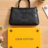 Louis Vuitton Trianon MM bag in black Monogram Empreinte leather.