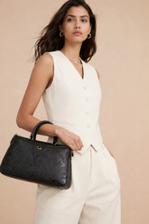 Louis Vuitton Trianon MM bag in black Monogram Empreinte leather.