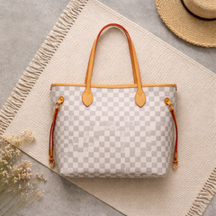 Louis Vuitton Damier Azur canvas bag with a brown leather trim.