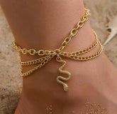 This boho multi-layer snake anklet is a versatile accessory made of golden alloy.