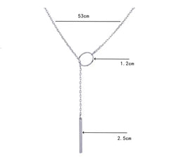 This product appears to be a minimal gold-plated lariat necklace featuring a circle and a vertical bar