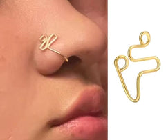 a Yheakne punk swirl spiral gold-tone clip-on nose cuff.