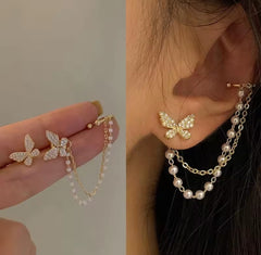 These earrings are described as Butterfly Pearl Earcuff Tassel Earrings, featuring a rhinestone-adorned butterfly stud connected to a cascading pearl chain ear cuff.