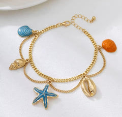 This is a gold-toned, multi-layer women's anklet featuring starfish and shell charms.