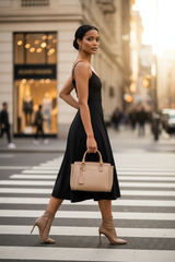 a beige Louis Vuitton top-handle handbag