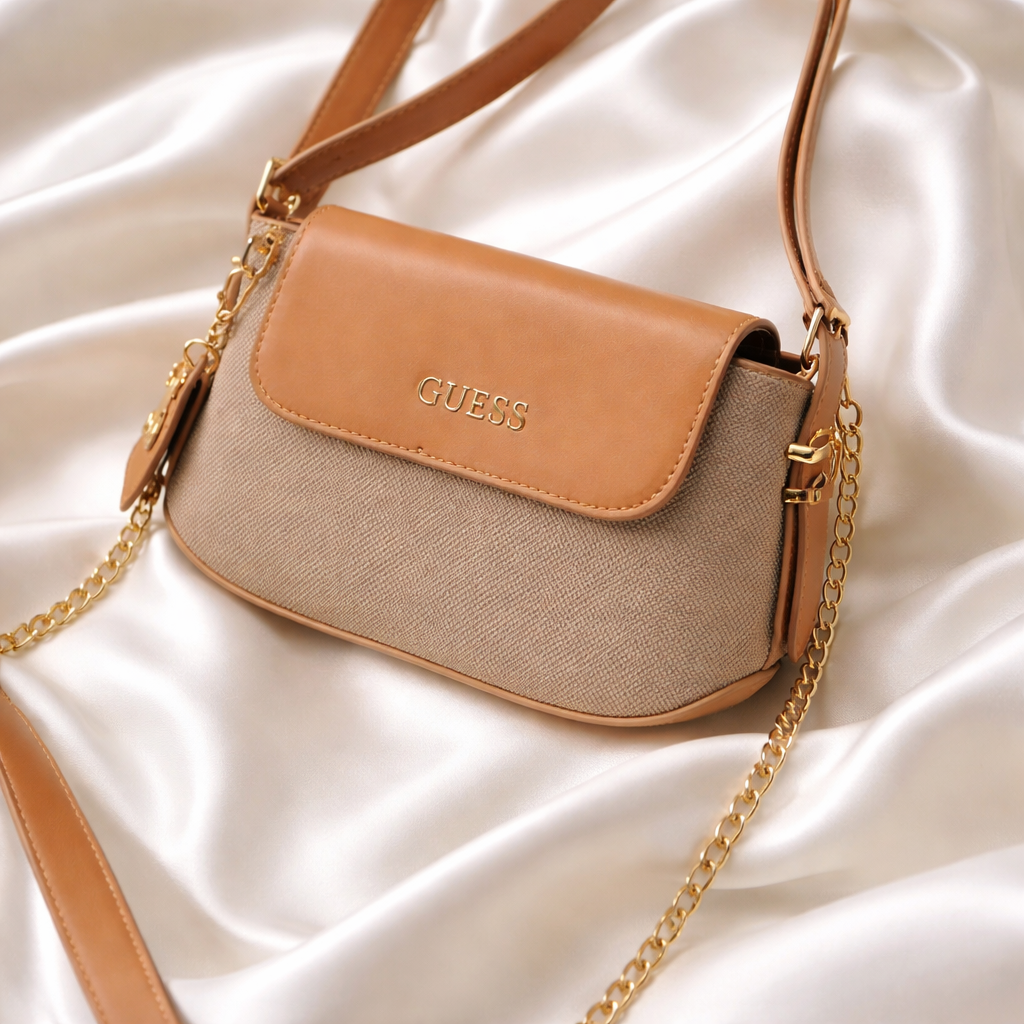 Guess faux-leather mini shoulder bag, possibly the Avelina model.  Dive deeper in AI