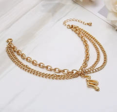 This boho multi-layer snake anklet is a versatile accessory made of golden alloy.