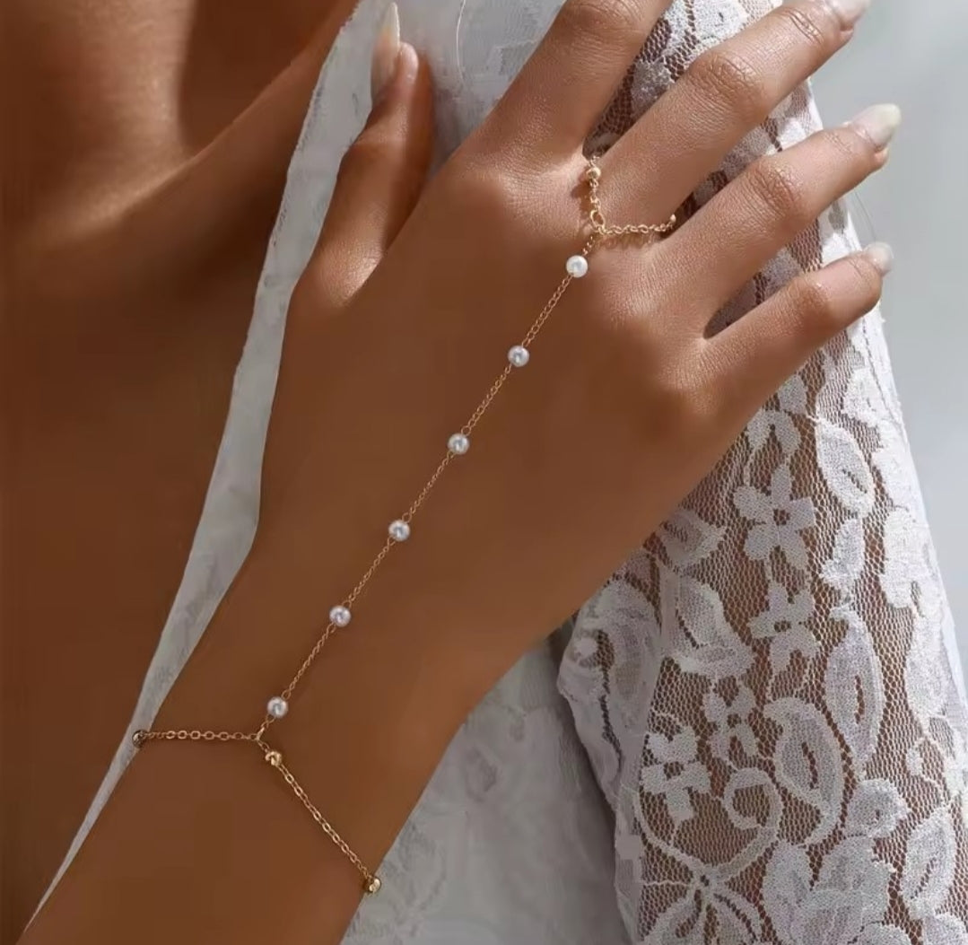 a pearl hand chain bracelet
