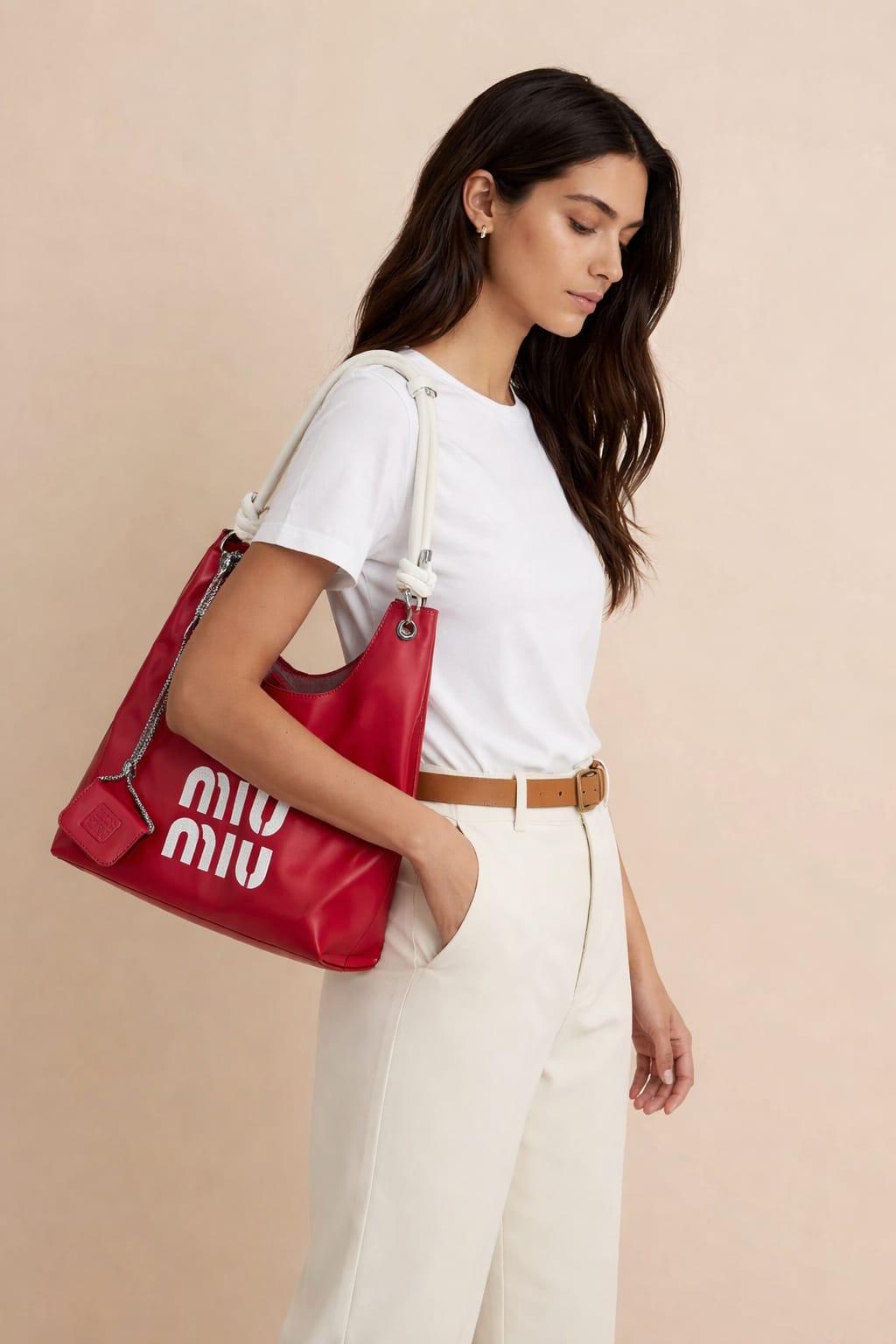 red Miu Miu hobo bag with a matching micro bag charm.